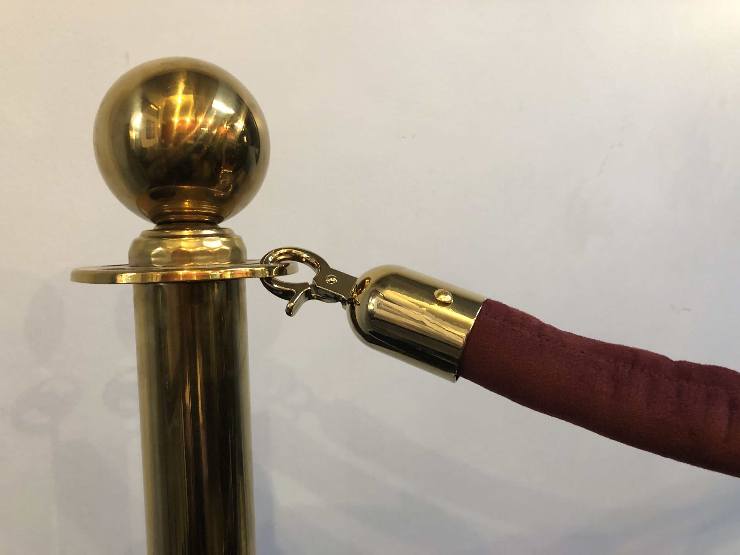 BRASS STANCHIONS WITH BURGUNDY VELVET ROPE