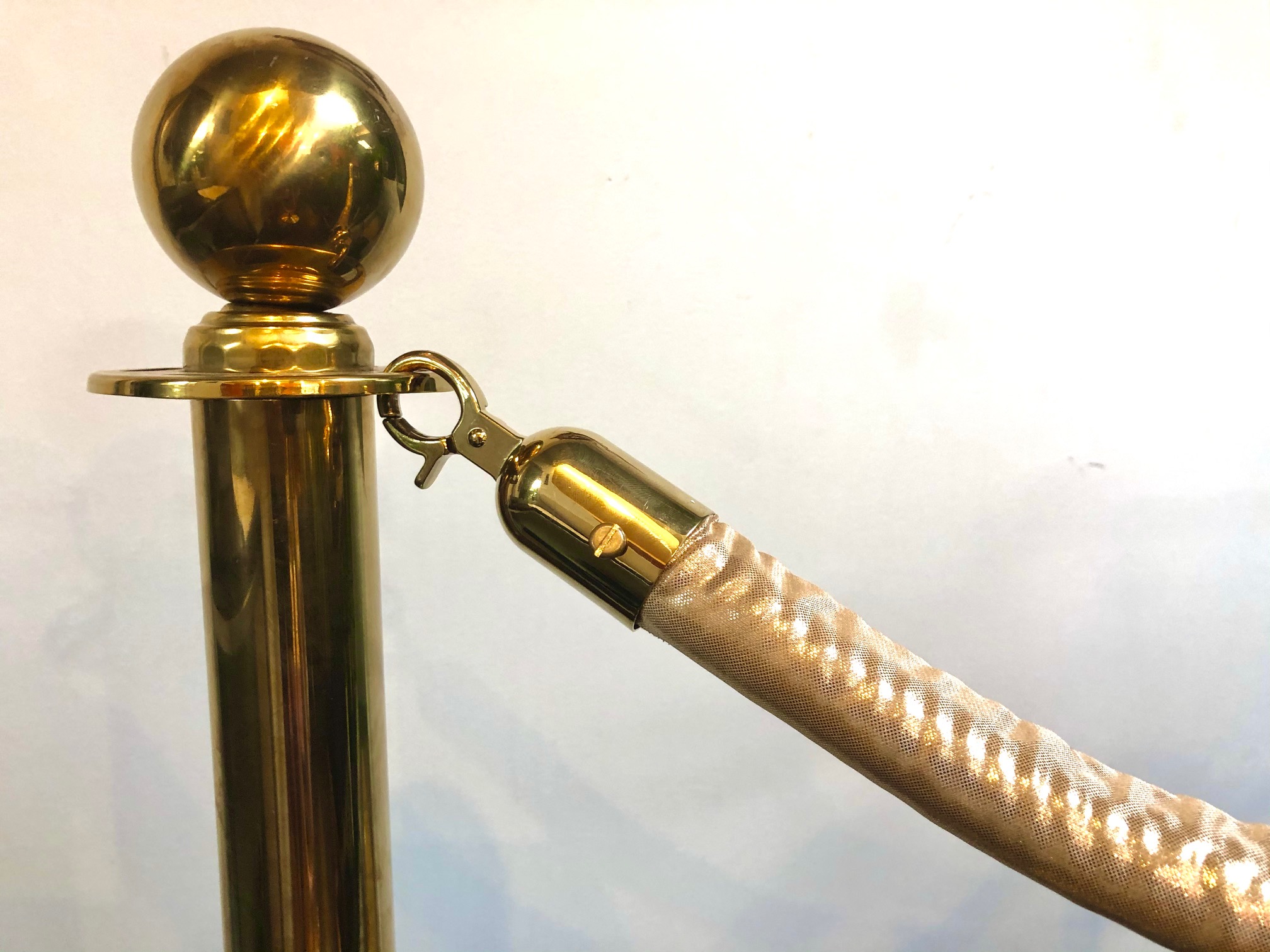 Brass stanchion with gold rope