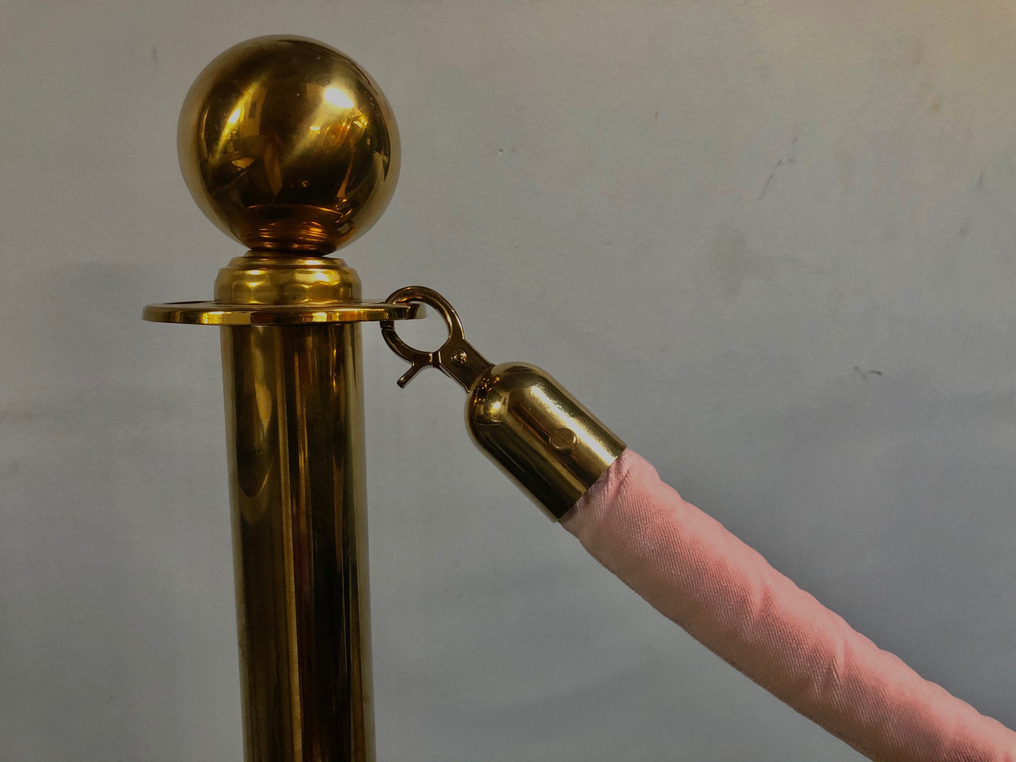 Brass stanchion with black rope